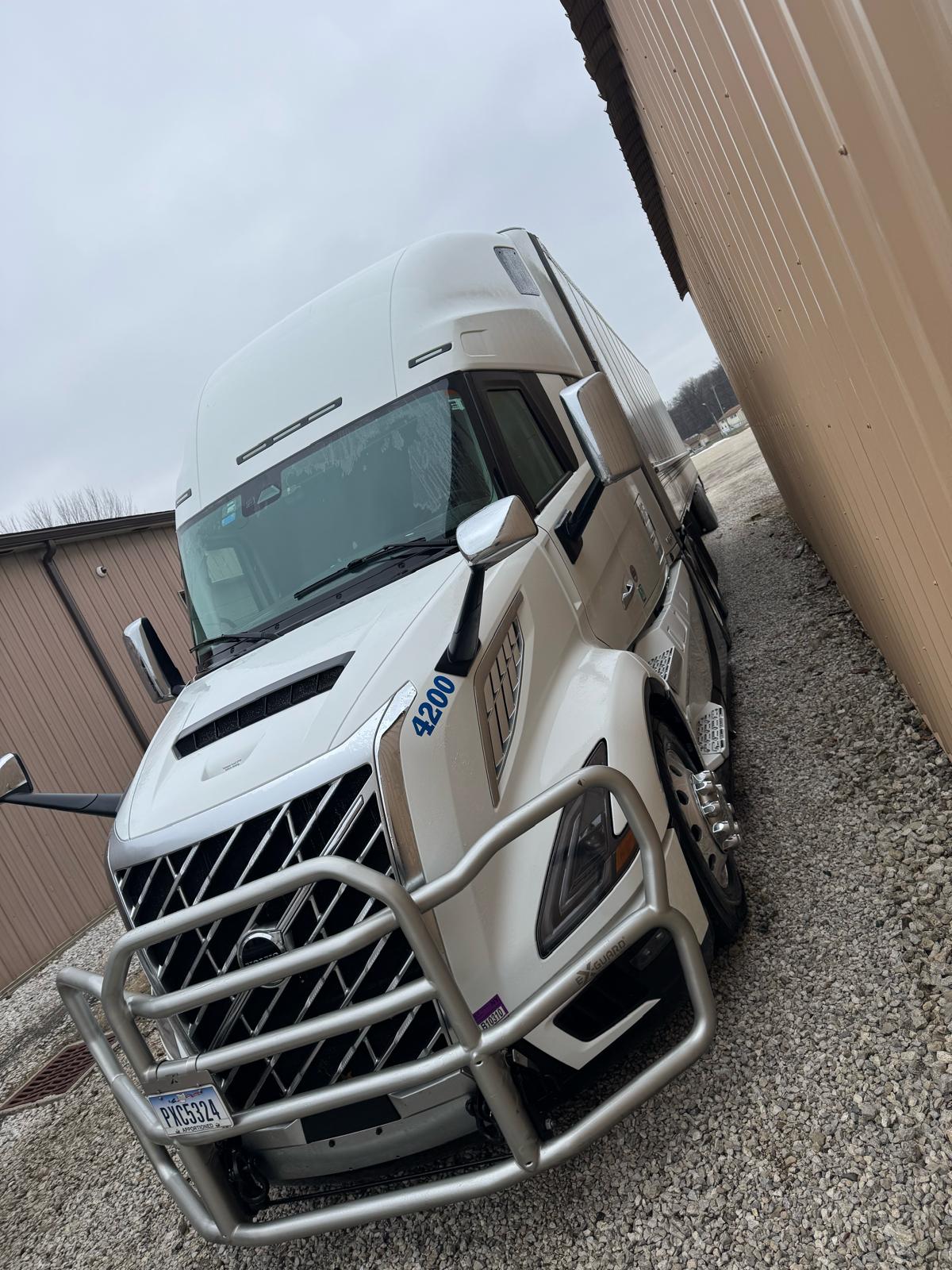 Clean white semi truck for fleet washing service